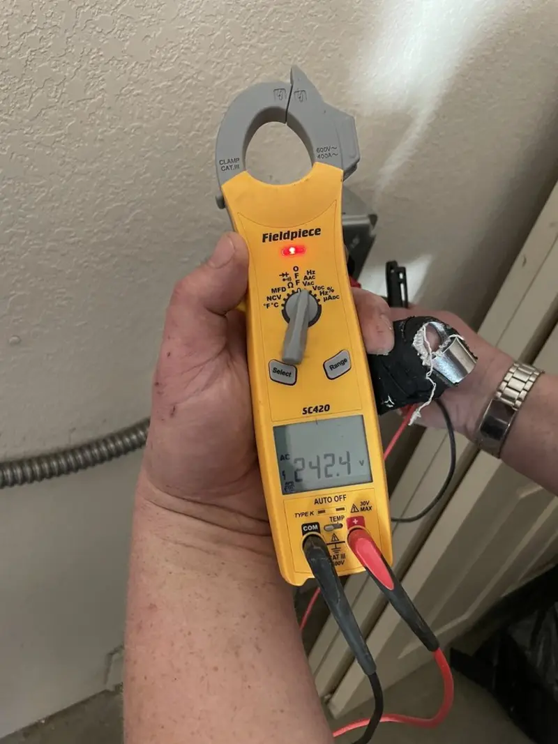 Voltage testing with clamp meter during Outlet Installation in St. Charles